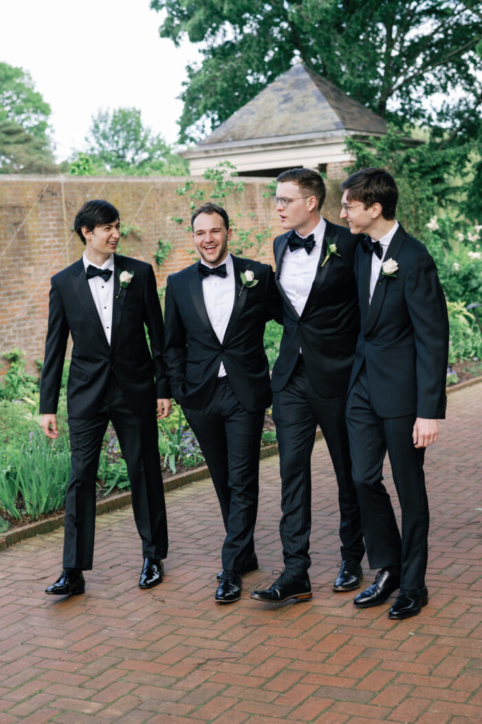 Groom with groomsmen walking at Chicago Botanic Garden