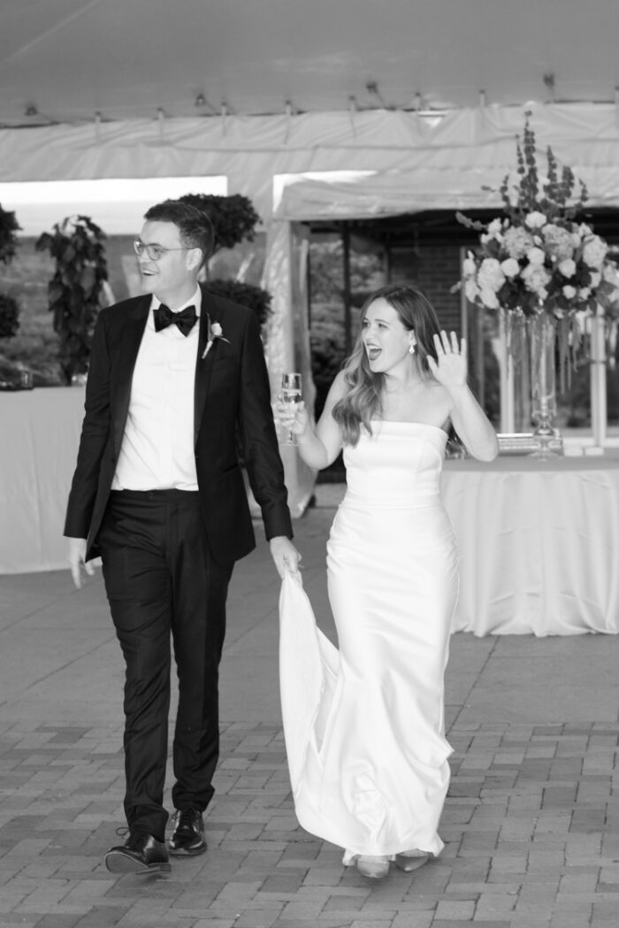 Bride and groom walking into their wedding reception at Chicago Botanic Garden