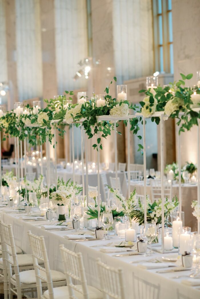 White and green high floral centerpieces by HMR Design