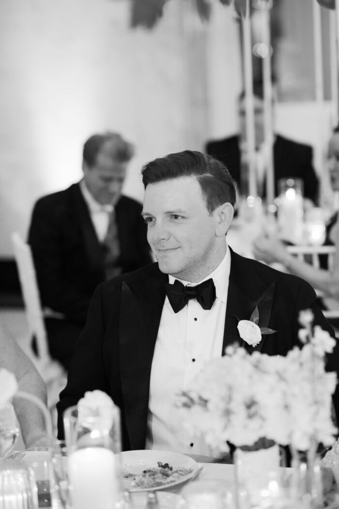 Groom smiling at his wedding reception in Chicago