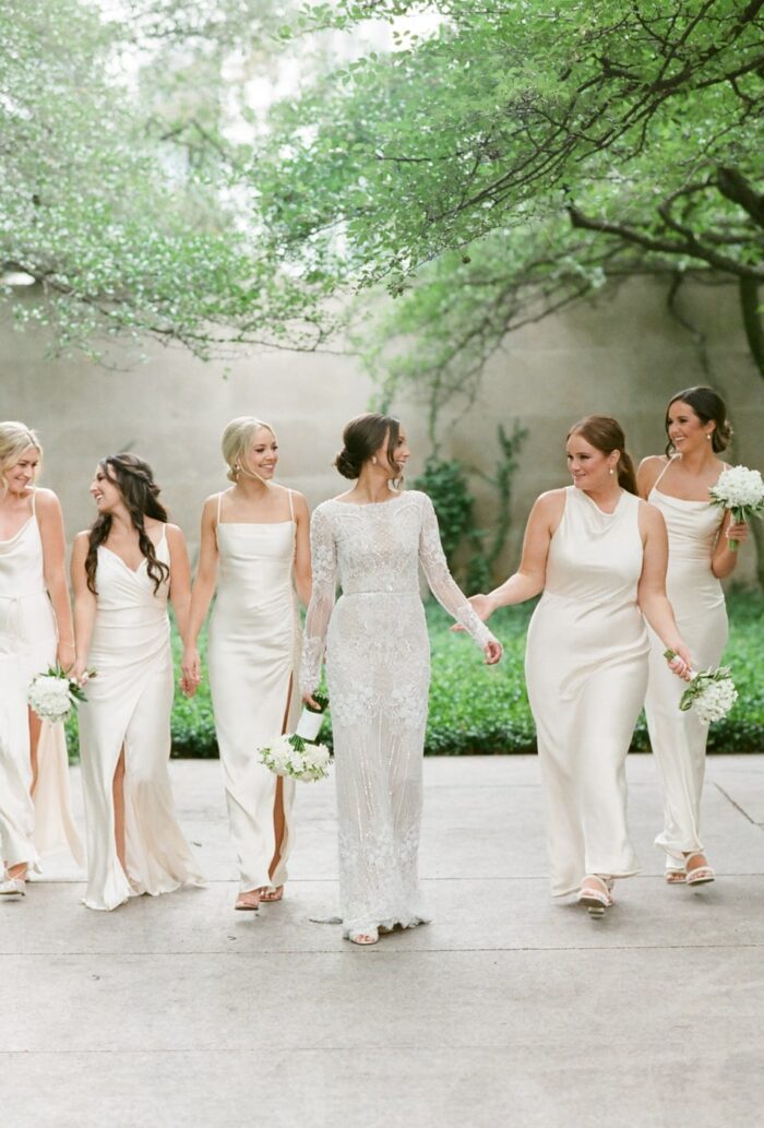 Bride and her bridesmaids walking at the Chicago Art Institute Garden