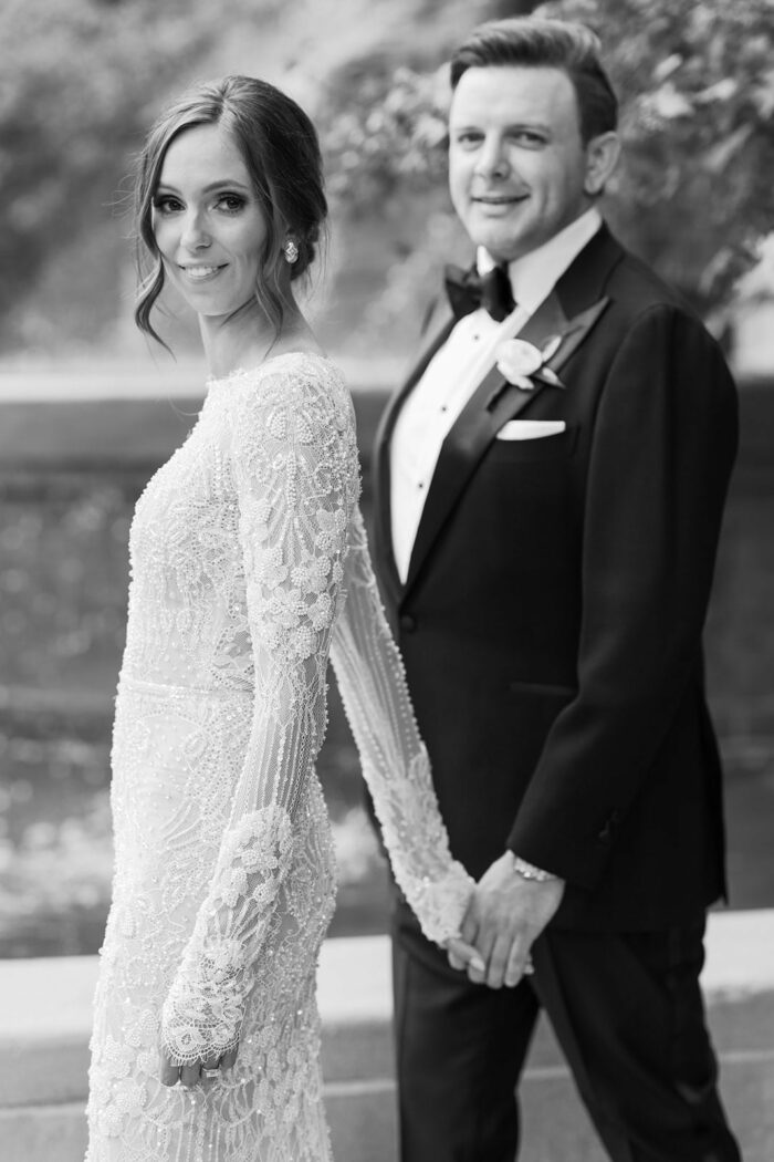 Bride and groom walking hand in hand in Chicago