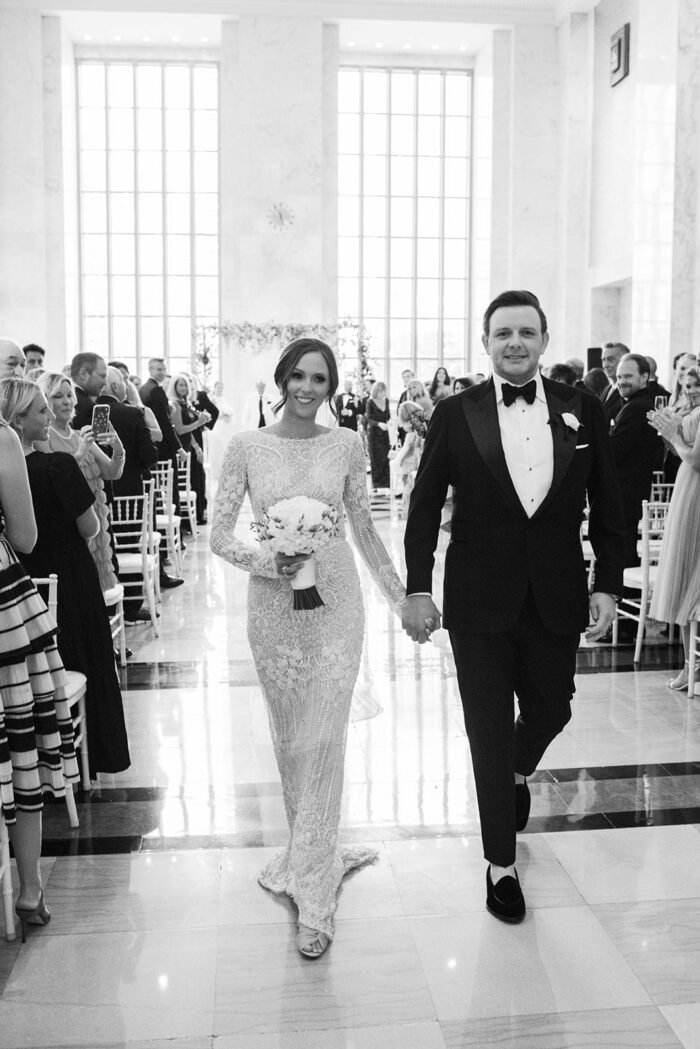 Bride and groom walking down the aisle during their Chicago wedding