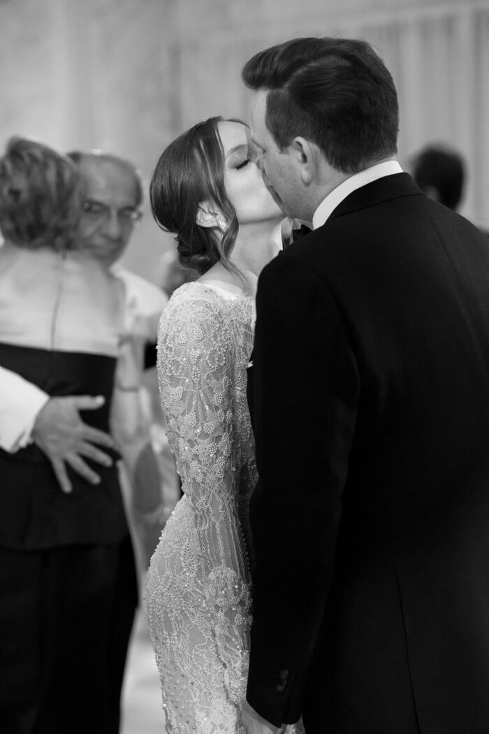 Bride and groom kissing during their first dance in Chicago