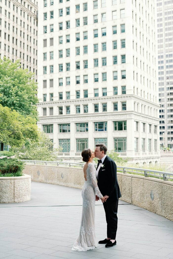 Bride and groom kissing for their first look kiss in Chicago