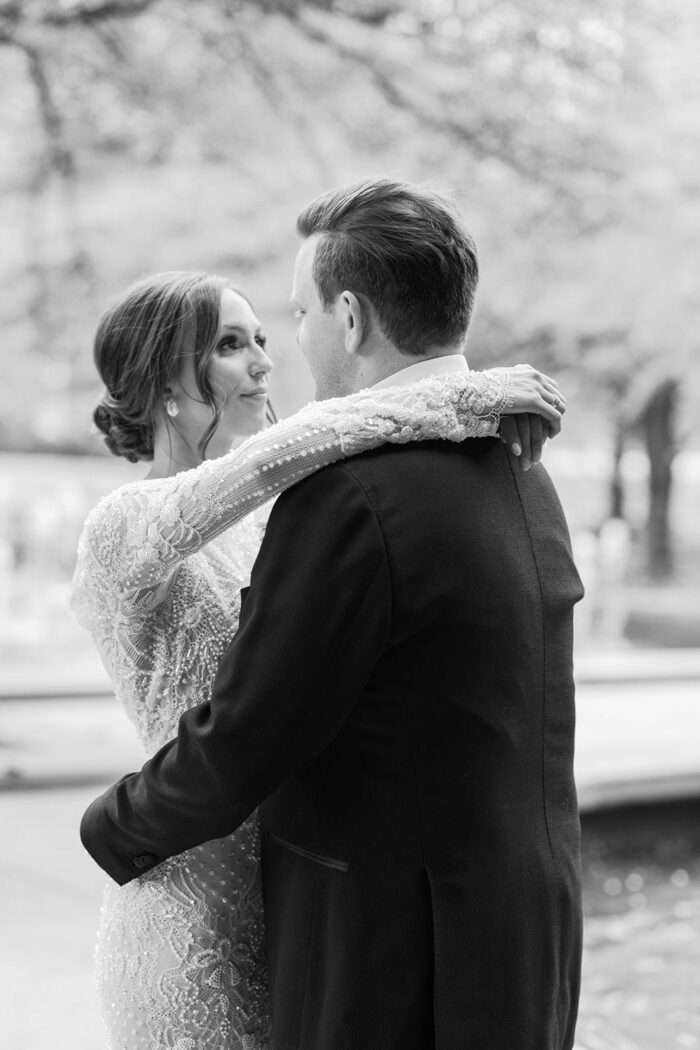 Bride and groom embracing each other at Chicago Art Institute