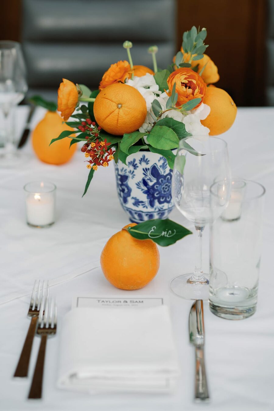 Floral wedding centerpiece with oranges
