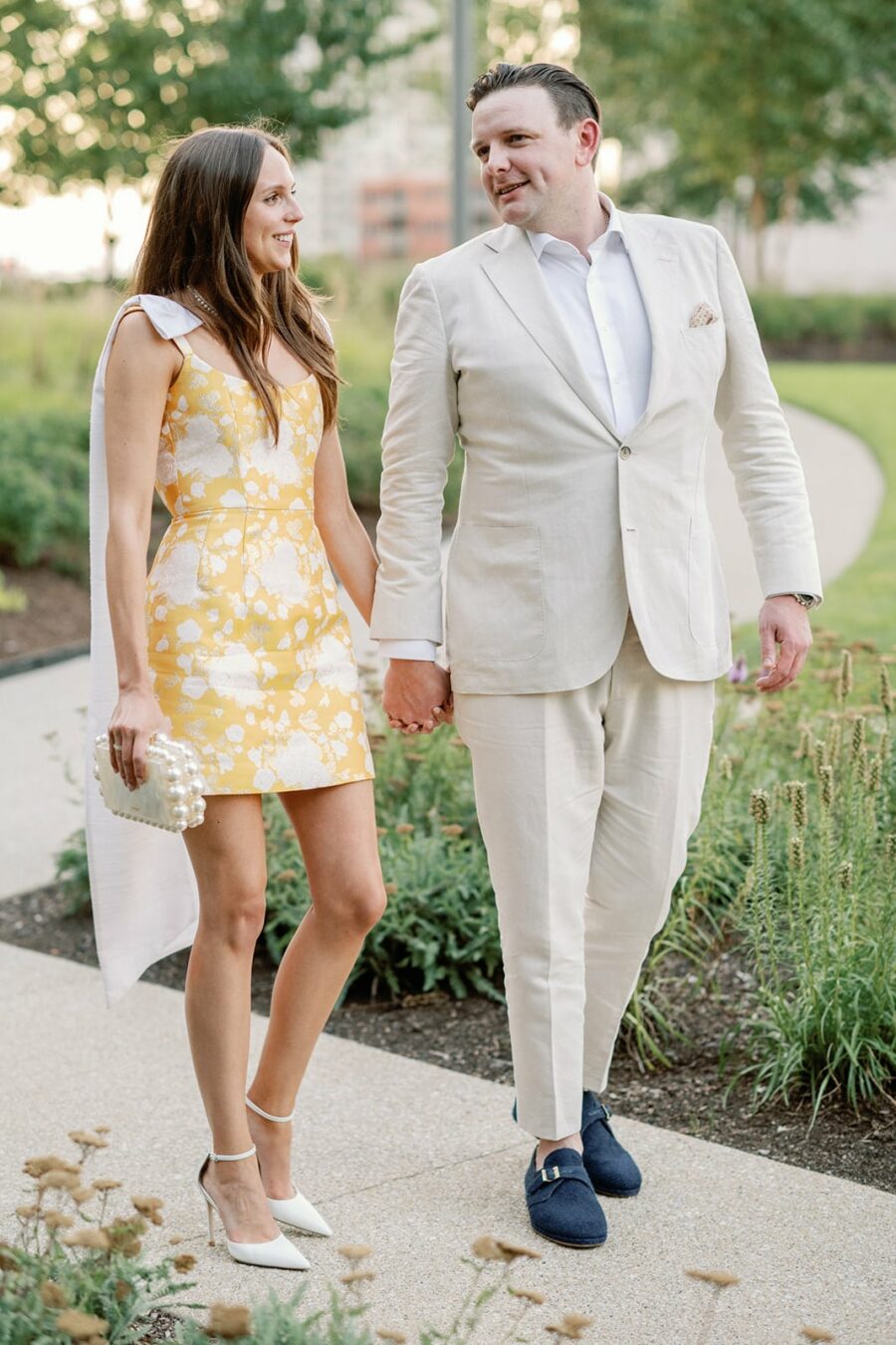 Bride and groom walking in the gardens of Gibsons Chicago Steakhouse
