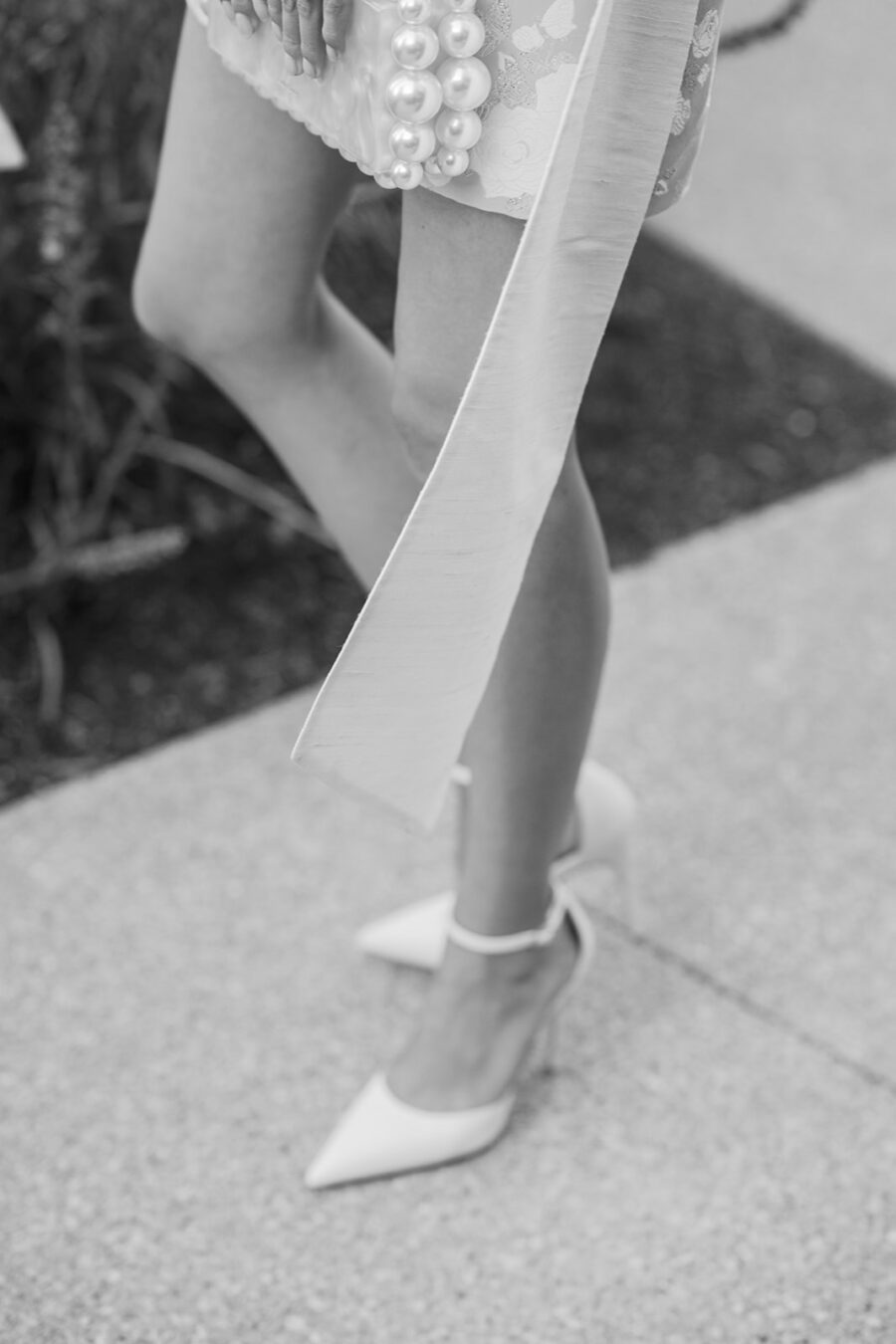 Closeup of white wedding shoes