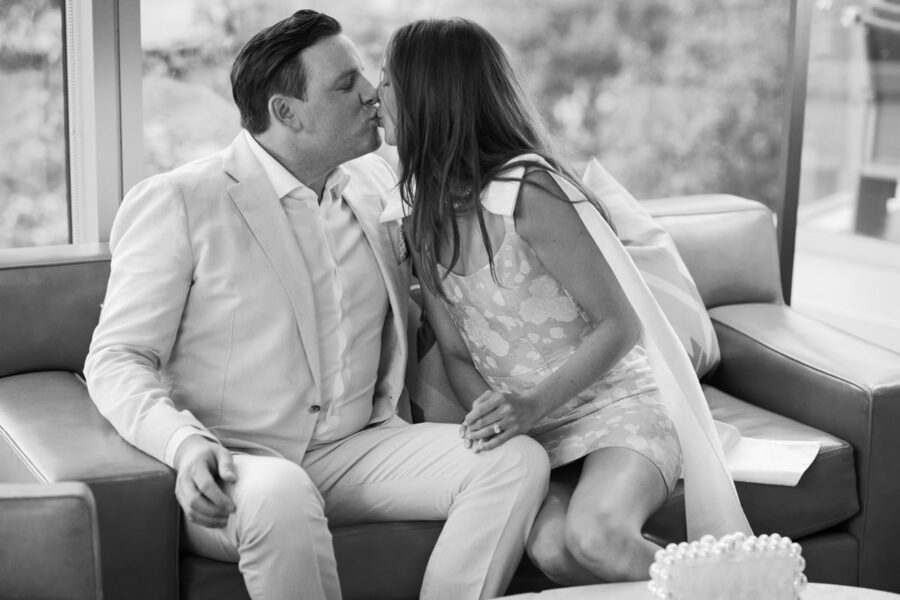 Bride and groom kissing at their rehearsal dinner in Chicago