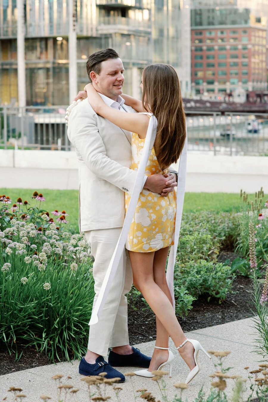 Bride and groom embracing each other in front of Gibsons Chicago Steakhouse