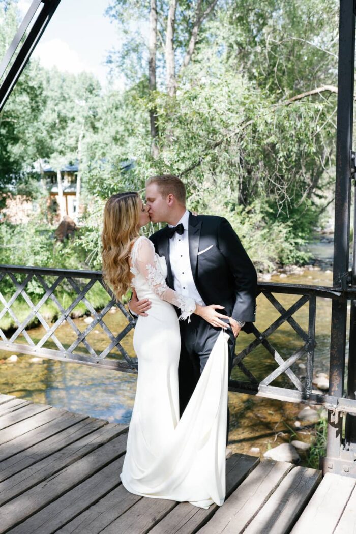 Bride and groom kissing each other in Aspen