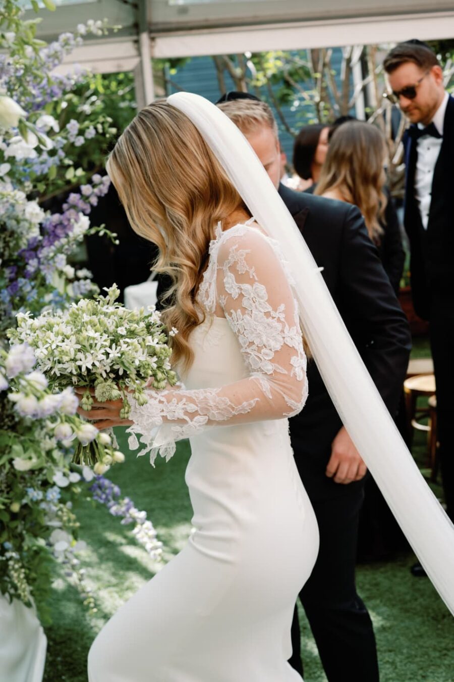 Aspen bride walking down the chuppah