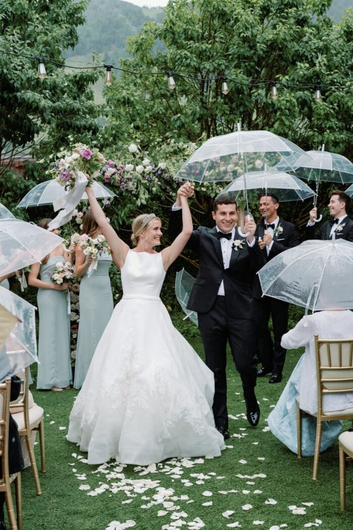 Bride and groom walking down the aisle after their wedding ceremony at Hotel Jerome