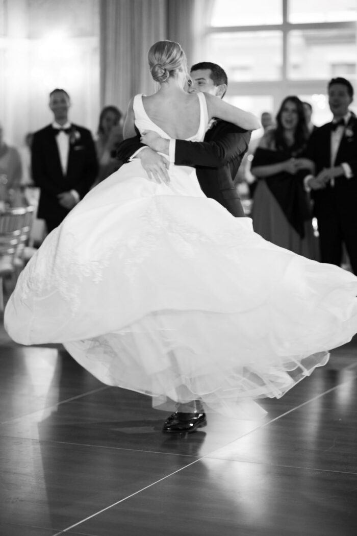 Groom is lifting his bride during first dance at Hotel Jerome