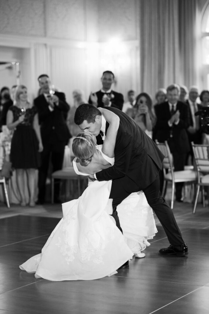 Groom and bride kissing during first dance at their Aspen wedding