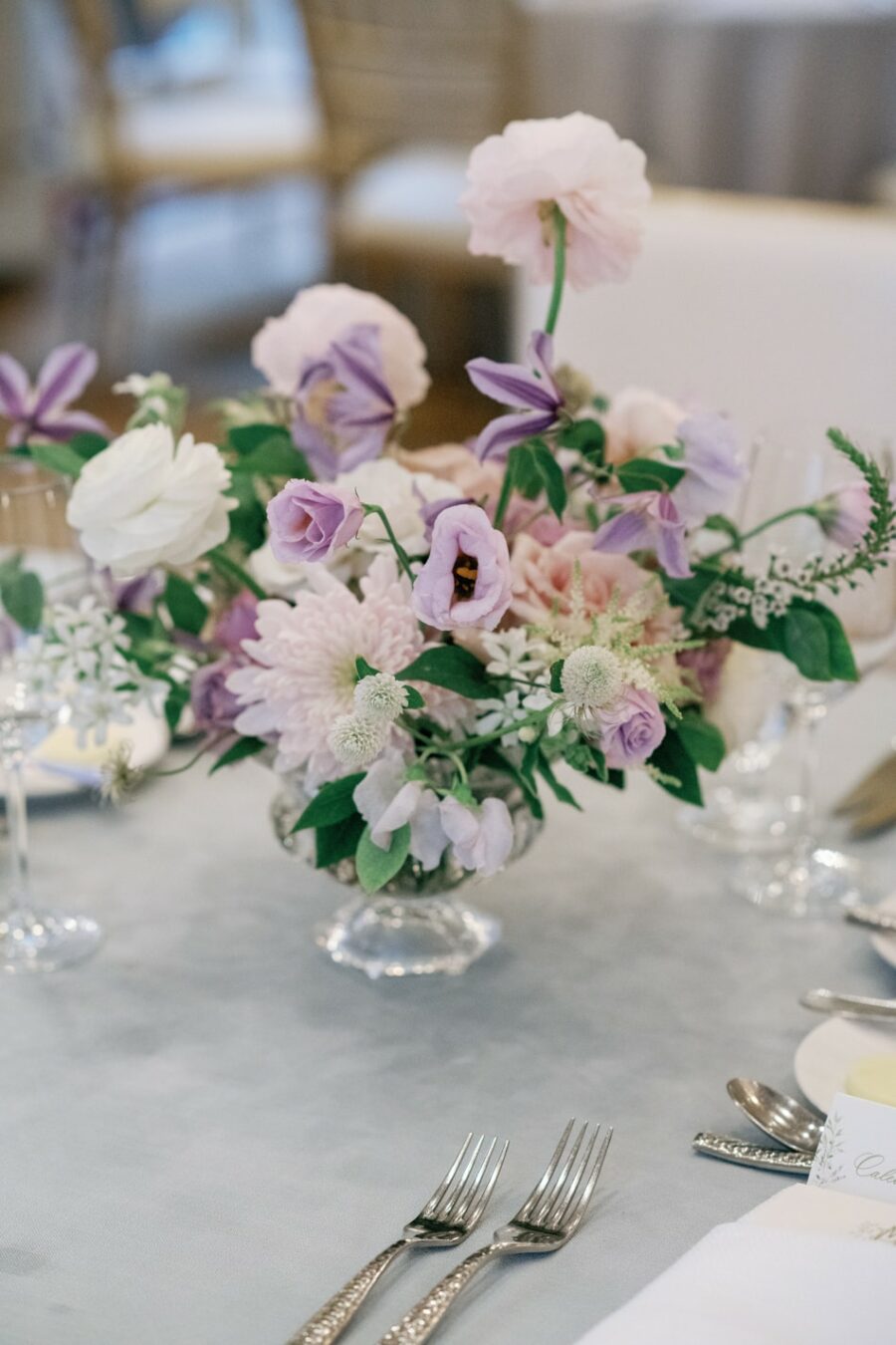 Purple themed wedding floral centerpieces