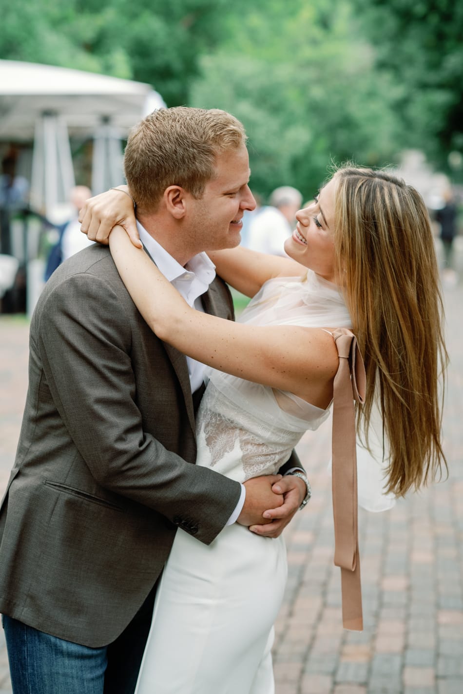 Bride and groom embracing each other during Aspen rehearsal dinner