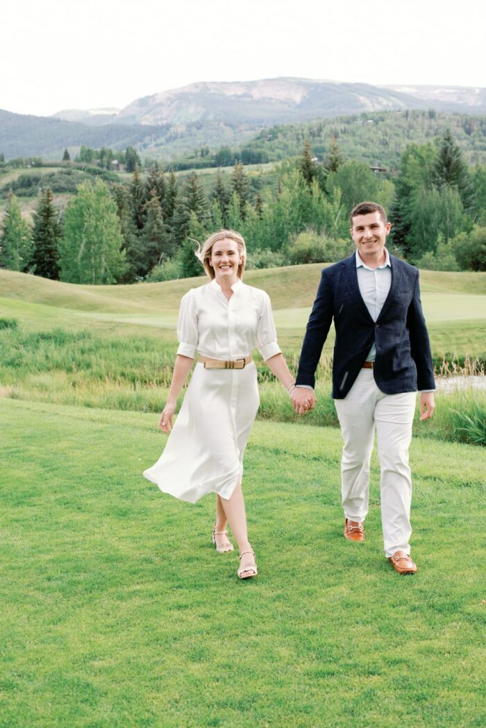 Bride and groom walking at the Snowmass Club