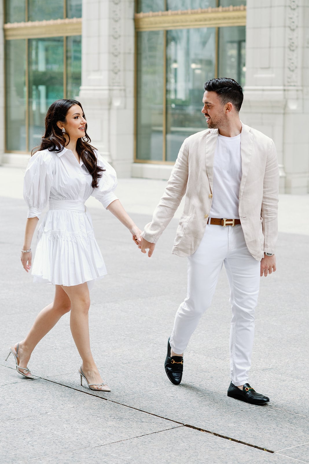 Bride and groom walking at Wrigley Building in Chicago