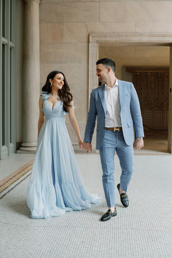 Bride and groom walking in the Chicago Art Institute