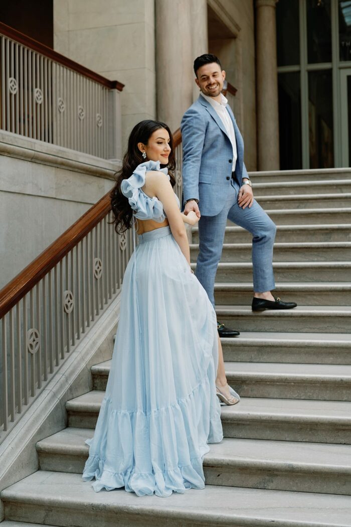 Bride in blue Mac Duggal gown on Chicago Art Institute stairs