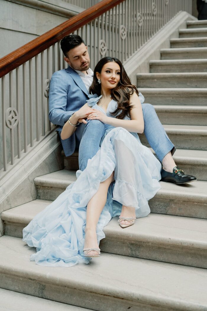 Bride and groom sitting on the stairs at the Chicago Art Institute