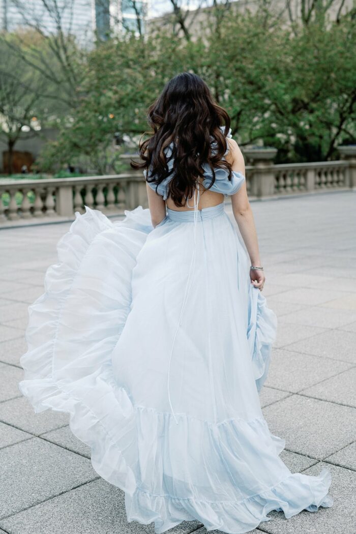 Bride in her flowy blue Mac Duggal gown
