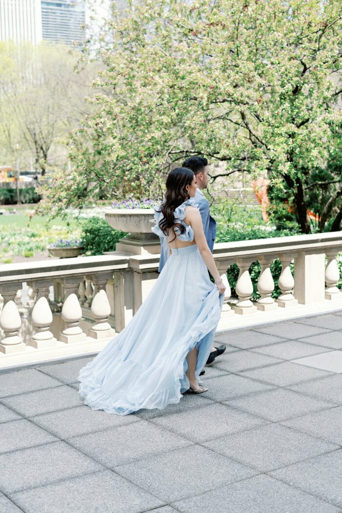 Bride and groom walking outside of the Chicago Art Institute
