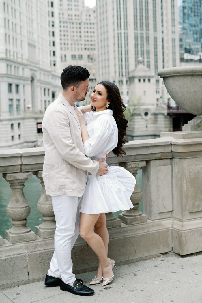 Bride and groom in front of Wrigley Building in Chicago